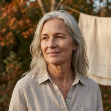 Woman in her fifties outdoors in warm afternoon light